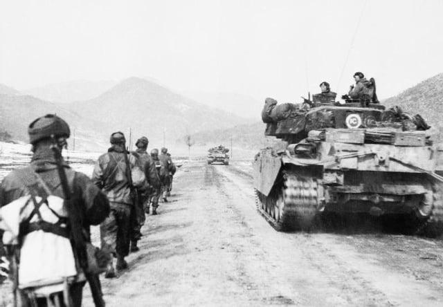 British UN troops advance alongside a Centurion tank, March 1951