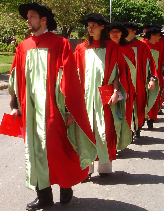 PhD candidates march at Commencement in McGill's distinctive scarlet regalia.
