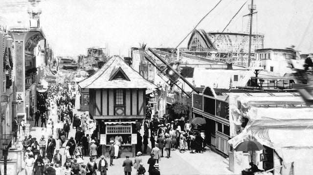 Crowds between 17th and 34th streets, with roller coaster in background, 1920 or before