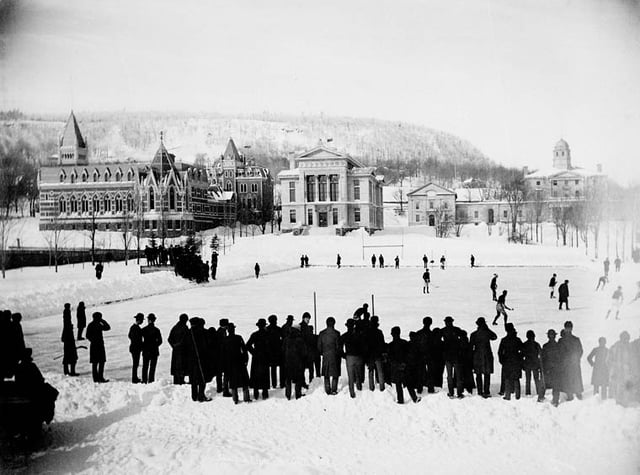 A hockey game on campus in 1884, just seven years after McGill students wrote the then-new game's first rule book, with the Arts Building, Redpath Museum, and Morrice Hall (then the Presbyterian College) visible