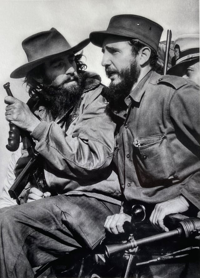 Castro (right) with fellow revolutionary Camilo Cienfuegos entering Havana on 8 January 1959