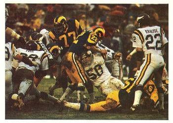 The Vikings' famed Purple People Eaters defensive line stopping a Rams rushing play in the NFC Divisional Playoff game.