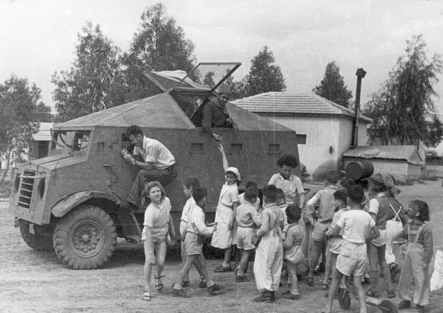 A "Butterfly" improvised armored car of the Haganah at Kibbutz Dorot in the Negev, Israel 1948. The armored car is based on CMP-15 truck. The car has brought supply to the kibbutz. The Negev Kibbutz's children were later evacuated by those cars from their kibbutz, before an expected Egyptian Army attack.