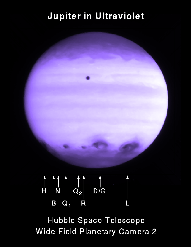 Jupiter in ultraviolet (about 2.5 hours after R's impact). The black dot near the top is Io transiting Jupiter.