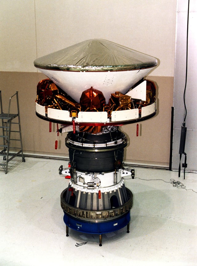 Mars Pathfinder during final assembly showing the aeroshell, cruise ring and solid rocket motor