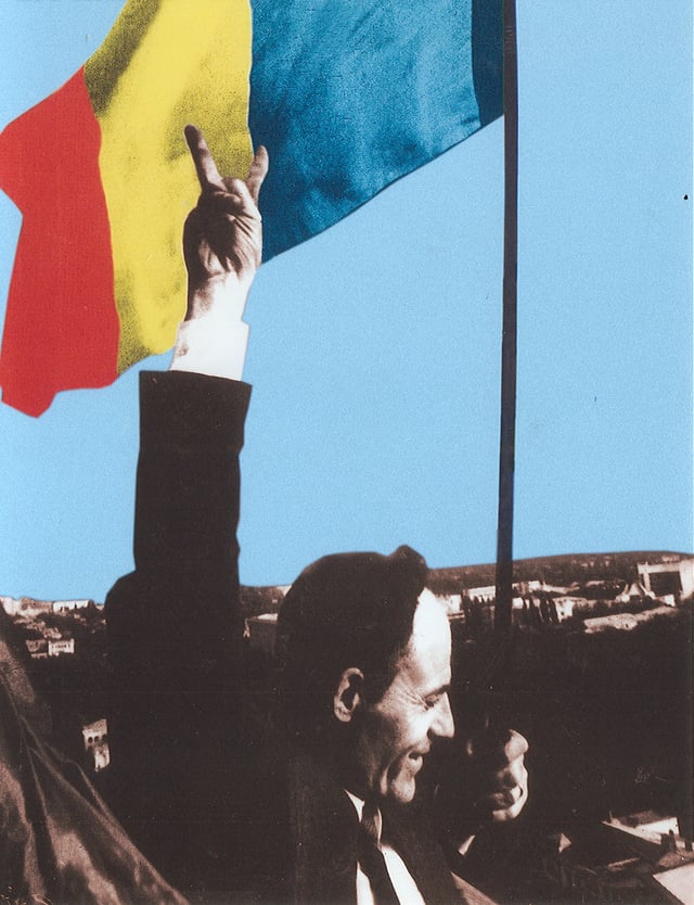 Deputy Gheorghe Ghimpu replaces the Soviet flag on the Parliament with the Romanian flag on 27 April 1990.