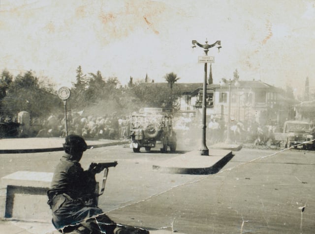 Βritish soldier taking aim at Greek Cypriot demonstrators in Nicosia, 1956
