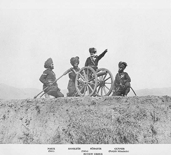 No. 4 (Hazara) Mountain Battery with RML7 pounder "Steel Gun" Mountain Gun in Review Order. Left to right Naick, Havaldar, Subadar (Sikhs) and Gunner (Punjabi Musalman) circa 1895.