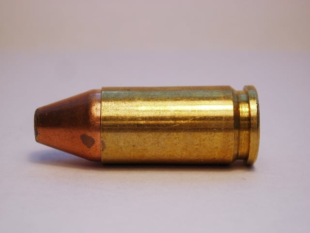 A 9mm Luger jacketed flat point cartridge variant