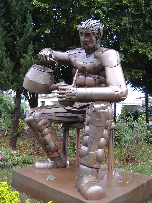 Statue of a man serving mate, in Posadas, Misiones, Argentina