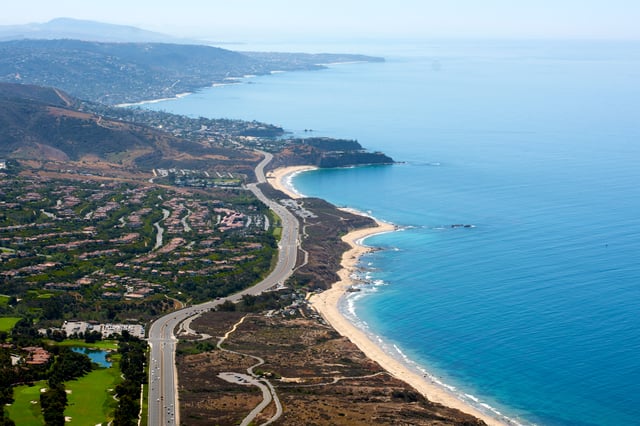 State Route 1 winds down the Orange County Coastline over Corona Del Mar state Beach