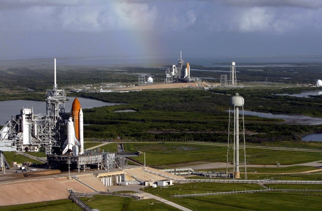Atlantis and Endeavour on launch pads. This particular occasion is due to the final Hubble servicing mission, where the International Space Station is unreachable, which necessitates having a Shuttle on standby for a possible rescue mission.