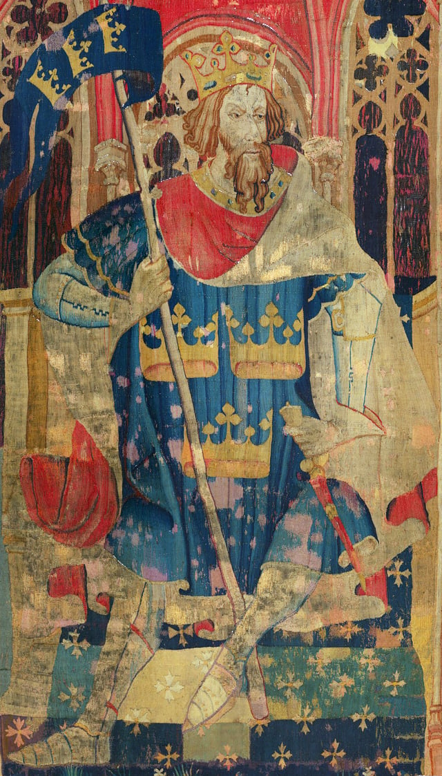King Arthur is a legendary figure of Sub-Roman Britain who is said to have fought the invading Saxons. Tapestry in The Cloisters, New York.
