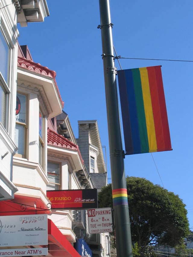 The rainbow flag, symbol of LGBT pride, originated in San Francisco; banners like this one decorate streets in The Castro.