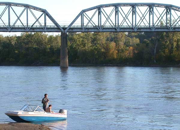 Fishermen on the Missouri River in Council Bluffs, facing the Union Pacific Bridge.