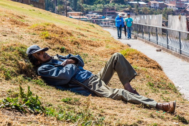 Man napping in San Cristóbal, Peru.