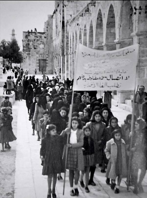 A 1930 protest in Jerusalem against the British Mandate by Arab women. The sign reads "No dialogue, no negotiations until termination [of the Mandate]".