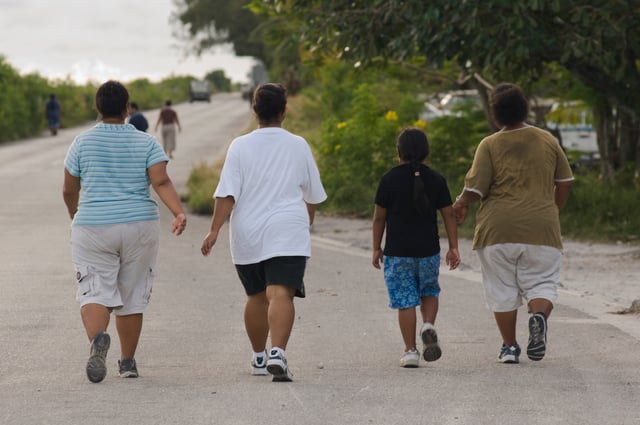 Nauruan residents walking around Nauru International Airport. Nauruans are amongst the most obese people in the world.