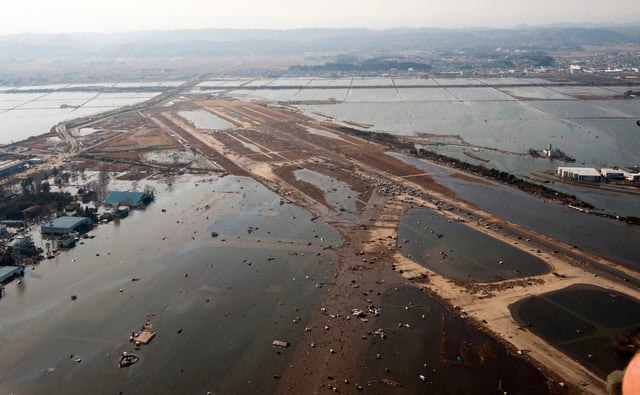 Tsunami flooding on the Sendai Airport runway
