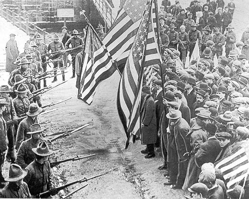 Bread and Roses Strike. Massachusetts National Guard troops surround strikers in Lawrence, Massachusetts, 1912.