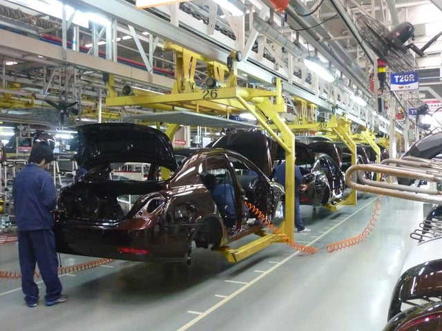 A car being assembled in a factory