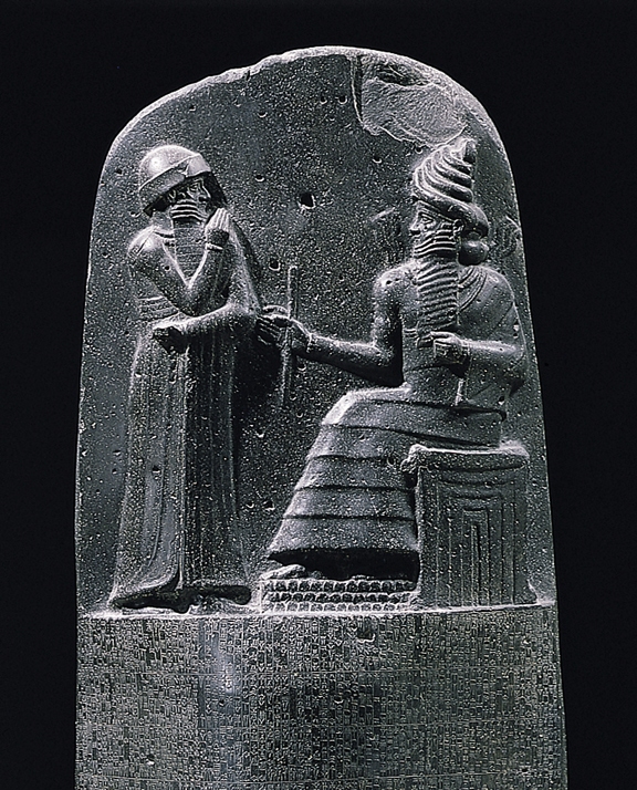 King Hammurabi is revealed the code of laws by the Mesopotamian sun god Shamash, also revered as the god of justice.