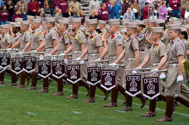 The Fightin' Texas Aggie Band's Bugle Rank leads the band at halftime at a football game.