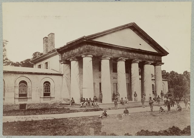 Many still know the home by its long-held former name, the Custis-Lee Mansion, here with Union soldiers on lawn (June 28, 1864)