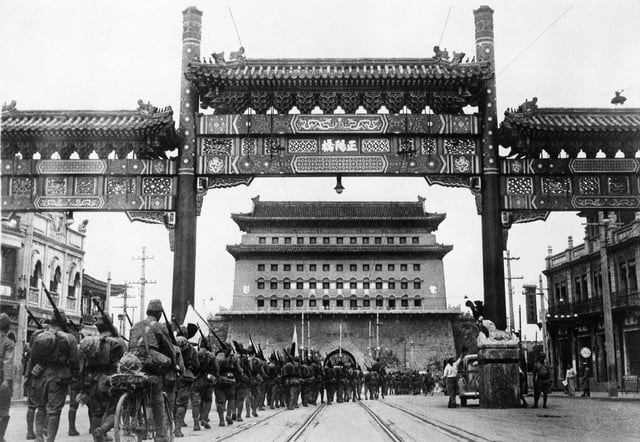 The Japanese occupation of Peiping (Beijing) in China, on August 13, 1937. Japanese troops are shown passing from Peiping into the Tartar City through Zhengyangmen, the main gate leading onward to the palaces in the Forbidden City.