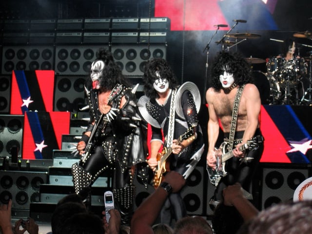Kiss performing in 2004, wearing makeup.