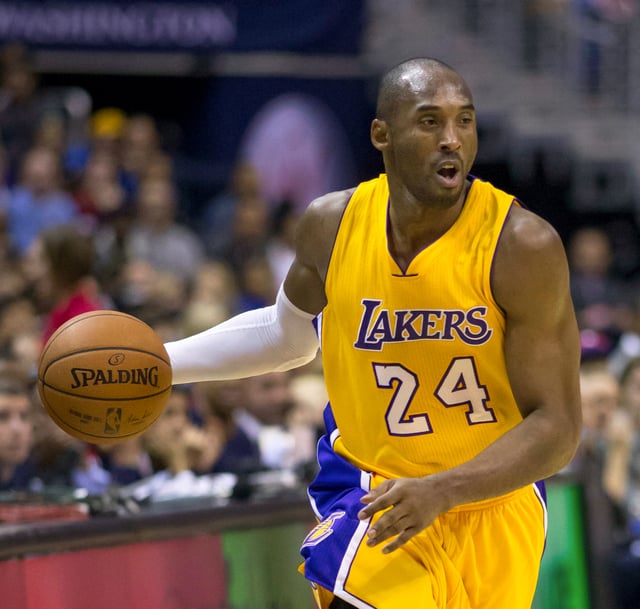 Bryant handling the ball in 2014, when he became the first NBA player with over 30,000 points and 6,000 assists