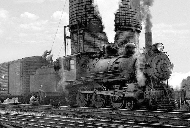 Watering a steam locomotive