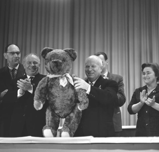 Khrushchev (holding the teddy bear) on his visit to East Germany with Nikolai Podgorny (clapping his hands)