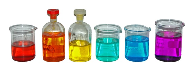 From left to right: aqueous solutions of: Co(NO3)2 (red); K2Cr2O7 (orange); K2CrO4 (yellow); NiCl2 (green); CuSO4 (blue); KMnO4 (purple).