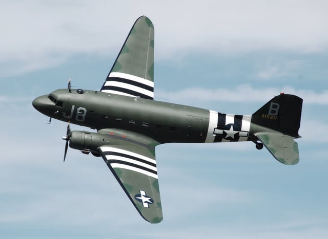 A former USAAF C-47A Skytrain which flew from a base in Devon, England, during the D-Day Normandy invasion and shows "invasion stripes" on her wings and fuselage
