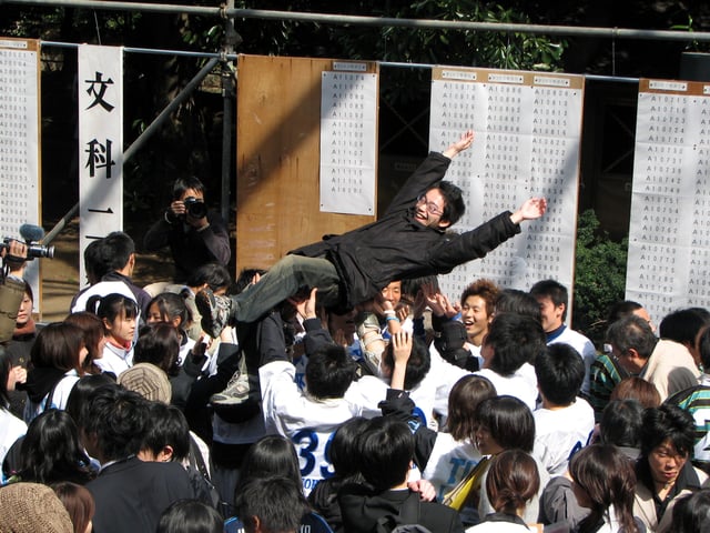 Students celebrating after the announcement of the results of the entrance examinations to the University of Tokyo