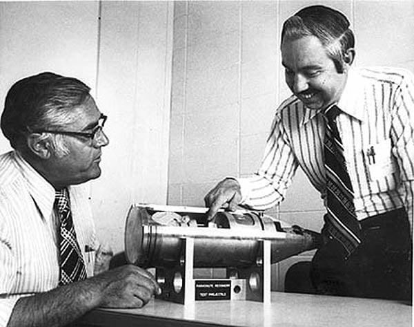 US scientists with a full-scale cut-away model of the W48 155 millimeter nuclear artillery shell, a very small tactical nuclear weapon with an explosive yield equivalent to 72 tons of TNT (0.072 kiloton). It could be fired from any standard 155 mm (6.1 inch) howitzer (e.g., the M114 or M198).