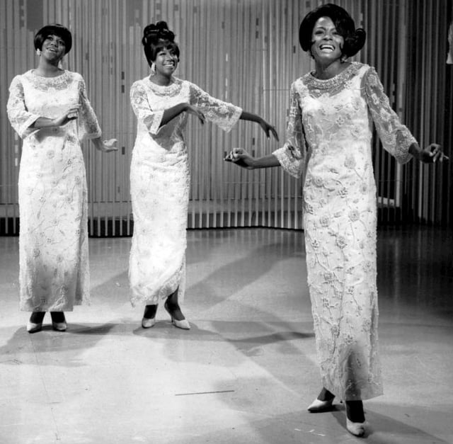 Ross (far right) performing with the Supremes as lead singer