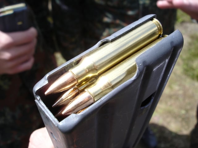 5.56×45mm NATO cartridges in a STANAG magazine.