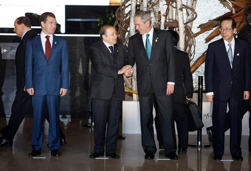 President Abdelaziz Bouteflika and George W. Bush exchange handshakes at the Windsor Hotel Toya Resort and Spa in Tōyako Town, Abuta District, Hokkaidō in 2008. With them are Dmitriy Medvedev, left, and Yasuo Fukuda, right.