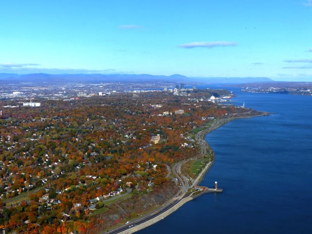 The Promontory of Quebec at the narrowing of the Saint Lawrence River and surrounded by the Laurentian Mountains.