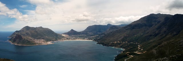 Panoramic view of Hout Bay from Chapman's Peak, with Chapman's Peak Drive visible at the base of the mountain