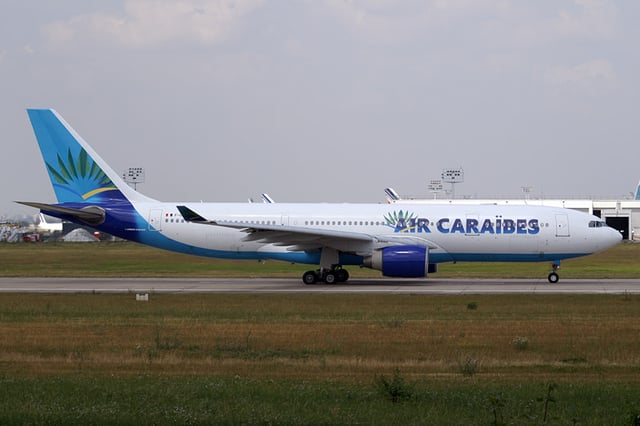 An Air Caraïbes Airbus A330-200 wearing the former livery.