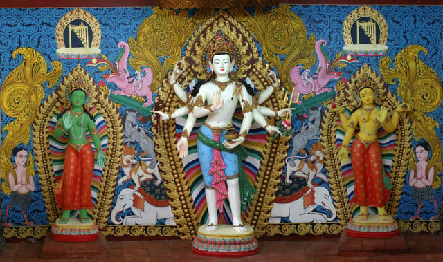 Magnificent clay images of Amoghpasha Lokesvara flanked by Arya Tara and Bhrikuti Tara enshrined at the side wing of Vasuccha Shil Mahavihar, Guita Bahi, Patan : This set of images is popular in traditional monasteries of Kathmandu Valley, Nepal.