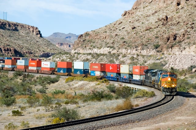 Freight train carrying containers through West Kingman Canyon, Arizona