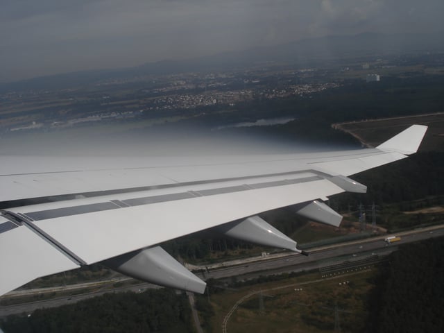 Condensation visible over the upper surface of an Airbus A340 wing caused by the fall in temperature accompanying the fall in pressure.