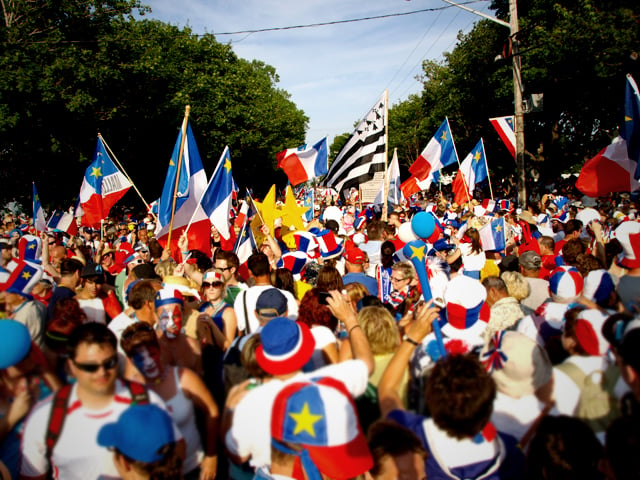 Acadians celebrating the Tintamarre and National Acadian Day in Caraquet, New Brunswick.