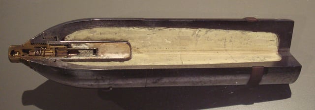 Picric acid was used in the first high-explosive shells. Cut out section of a high-explosive shell belonging to a Canon de 75 modèle 1897.