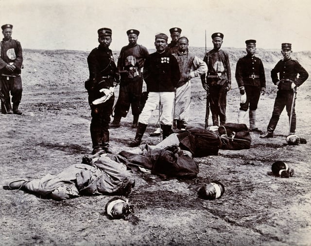 Boxers beheaded in front of a group of Chinese and Japanese officials