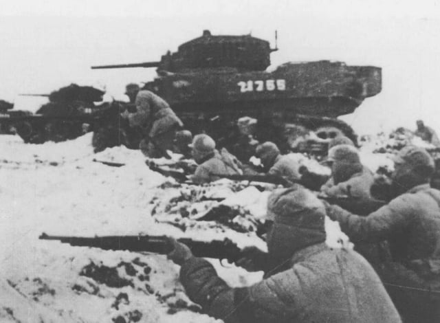 PLA troops, supported by captured M5 Stuart light tanks, attacking the Nationalist lines in 1948